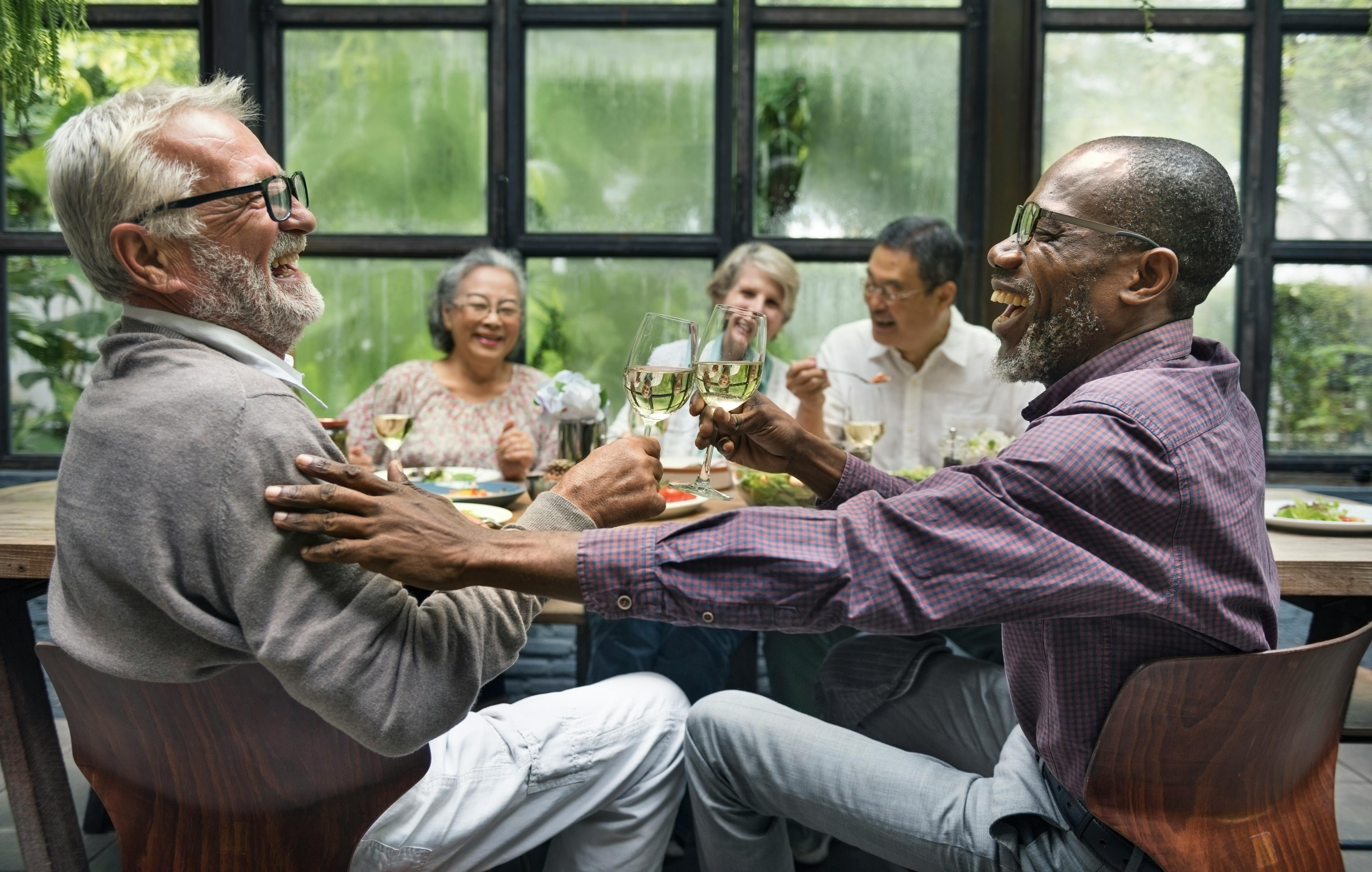 People enjoying dinner together at 50 Plus Circle